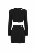 Black two-piece outfit with button details on a white background